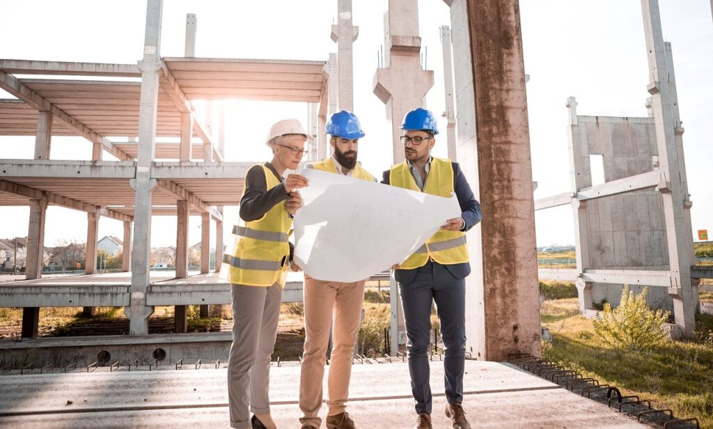 Engineers reviewing plans on a construction site