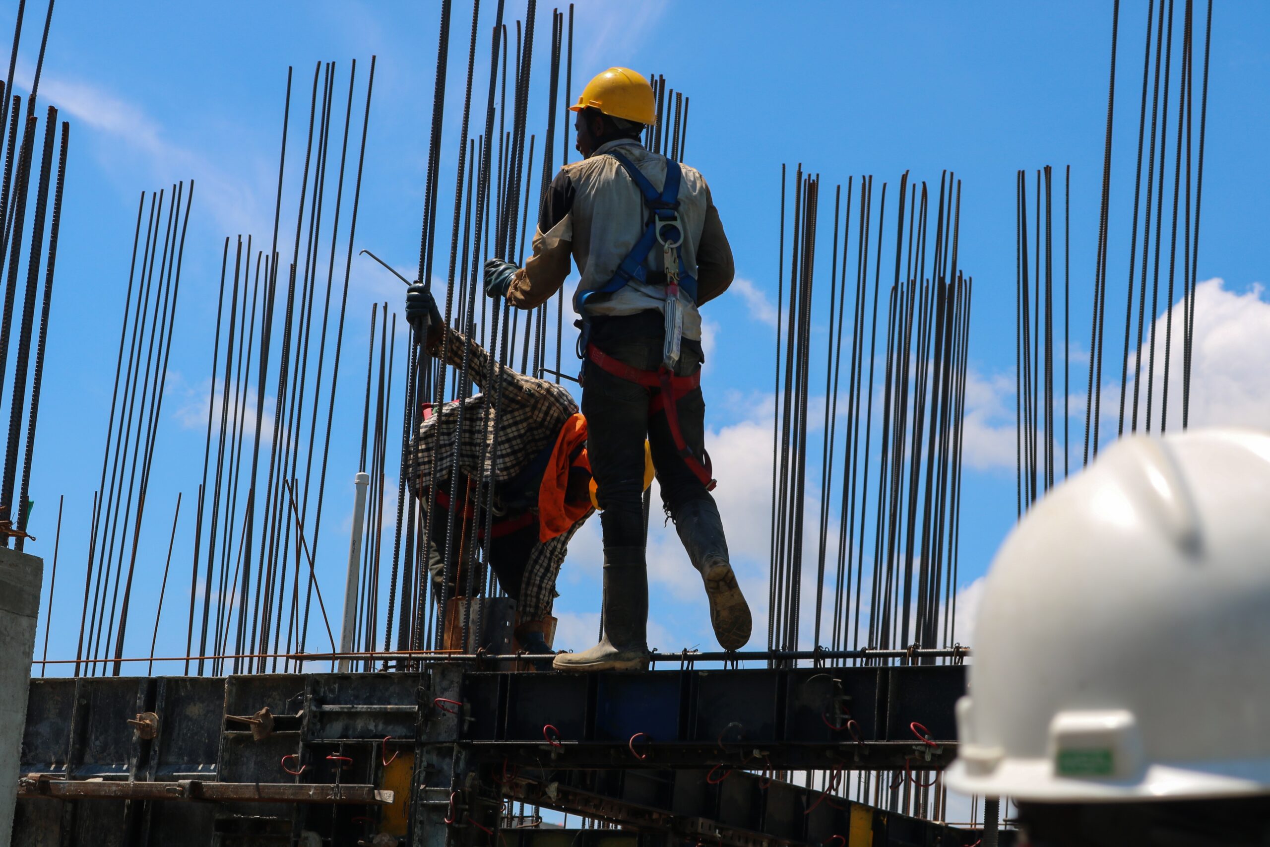 construction workers building a steel structure