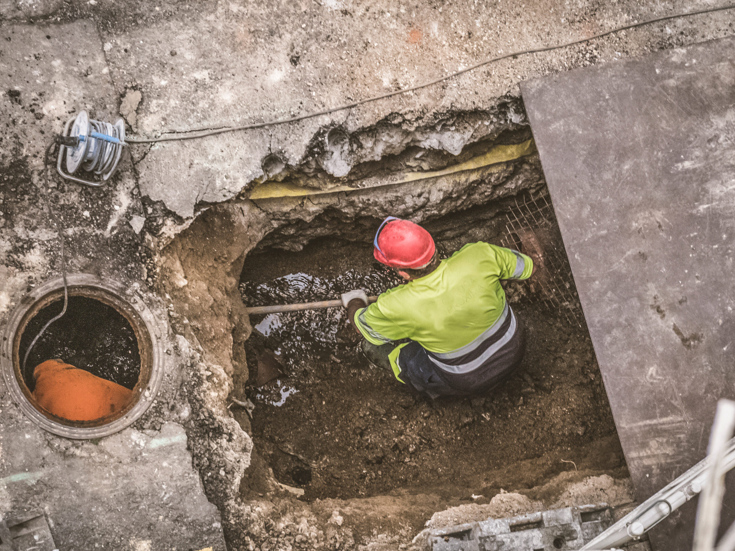 Construction worker repairing a sewer.