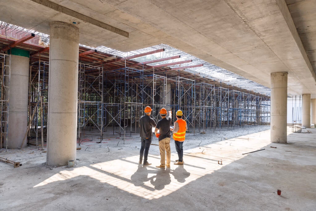 Engineers inside a concrete building under construction
