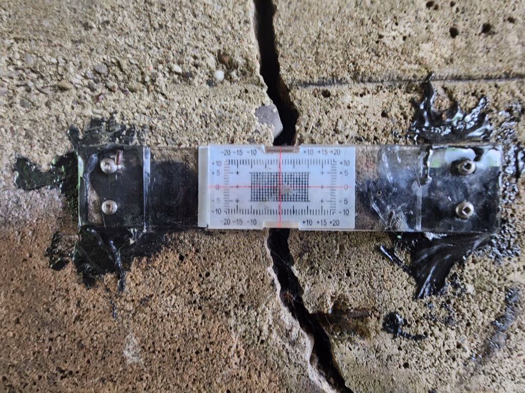 Crack monitoring gauge mounted across a crack in concrete, Township of Springwater bridge